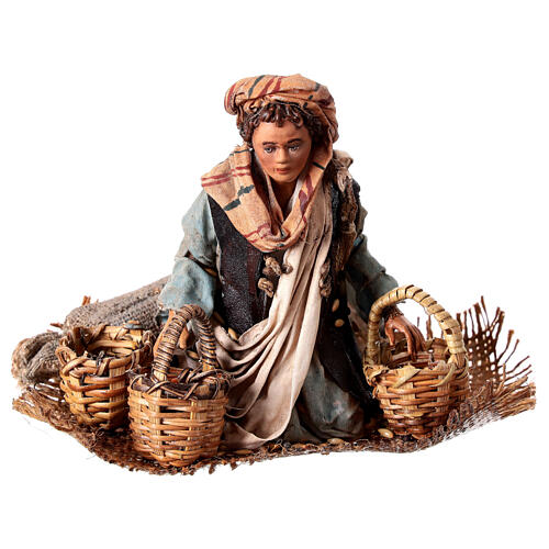 Young man on his knees with baskets, Angela Tripi's Nativity Scene of 13 cm 1