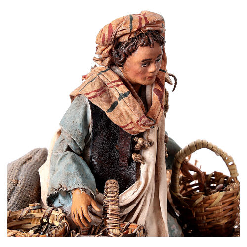 Young man on his knees with baskets, Angela Tripi's Nativity Scene of 13 cm 2