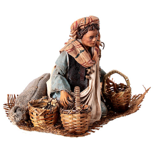 Young man on his knees with baskets, Angela Tripi's Nativity Scene of 13 cm 3