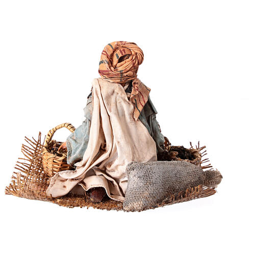 Young man on his knees with baskets, Angela Tripi's Nativity Scene of 13 cm 6