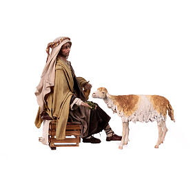 Sitting shepherd with sheep Angela Tripi 30 cm