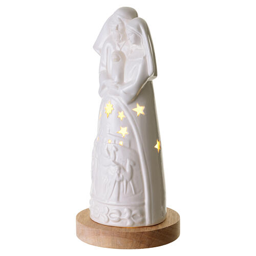 Porcelain Nativity with wooden base, 10 in 4