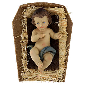 Colored resin Baby Jesus in manger, 20 cm