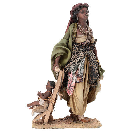 Brown woman with baby stroller figurine, 30 cm Angela Tripi 1