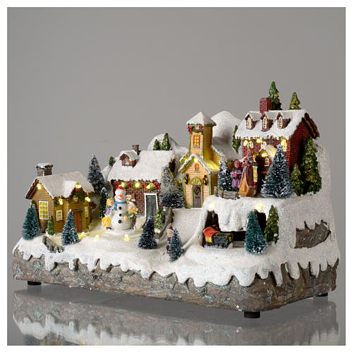 Village de Noël avec bonhomme de neige en mouvement 25x35x15 cm 3