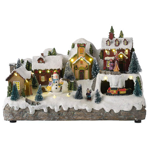 Villaggio natalizio con pupazzo di neve in movimento 25x35x15 cm 1