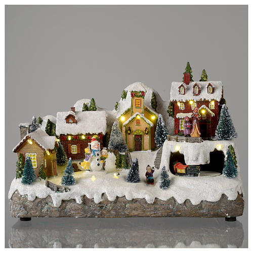 Villaggio natalizio con pupazzo di neve in movimento 25x35x15 cm 2