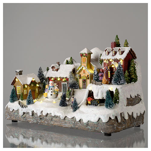 Villaggio natalizio con pupazzo di neve in movimento 25x35x15 cm 3