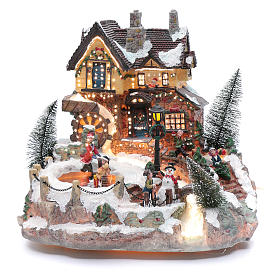 Winter village with ice skating rink, movement and lights 25x30x30 cm