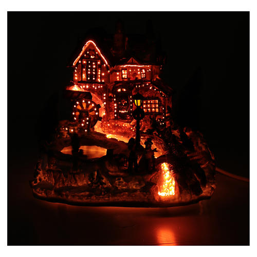 Winter village with ice skating rink, movement and lights 25x30x30 cm 5