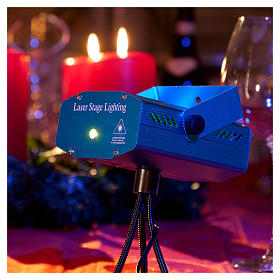 Christmas laser lights projector blue with Christmas decorations for interiors