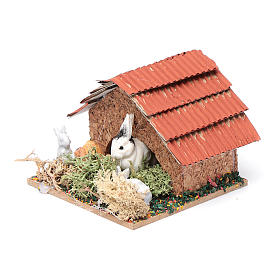 Crib hutch with rabbits.