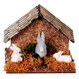 Crib hutch with rabbits.