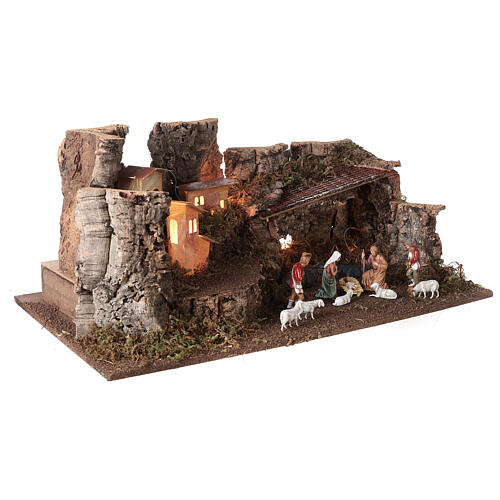 Nativity grotto with landscape and lights 28x58x32cm 5