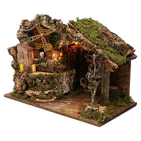 Nativity illuminated stable with village setting and wind mill 37x26x50cm