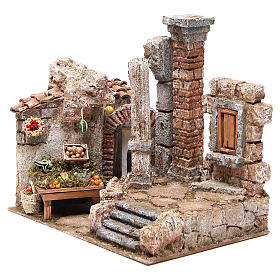 Casas, ambientaciones y tiendas: Aldea con columna y banquete belén 28x30x20 cm