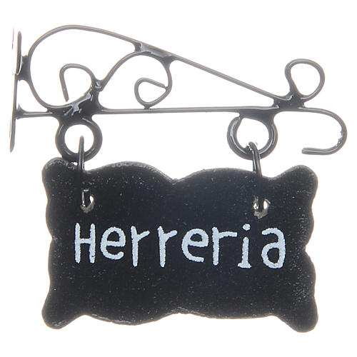 Tabliczka z napisem po hiszpańsku Herreria do szopki 1