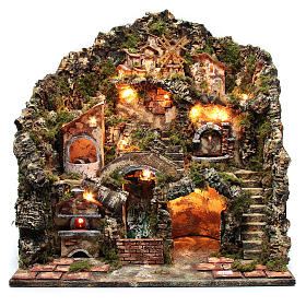 Illuminated nativity scene with functioning oven, waterfall, fountain, grinder and windmill
