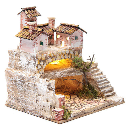Nativity scene with a cave and a group of houses 25x25x20 cm 3