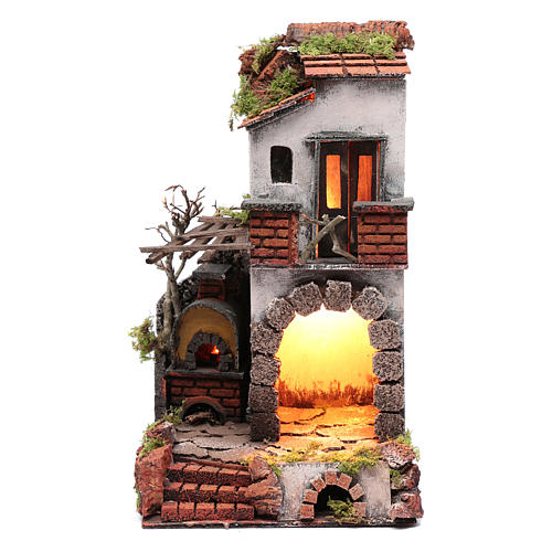 Neapolitan nativity scene setting composed by house with chimney and lights 1