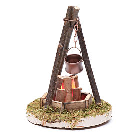 Nativity scene setting with fire and pot