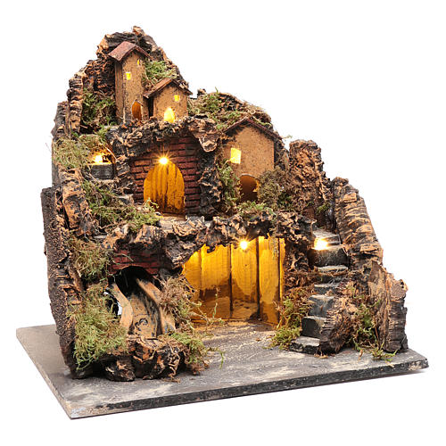 Nativity village in country style with illuminated grotto and river 3