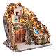 Neapolitan nativity scene setting with hut under a group of houses and waterfall s3