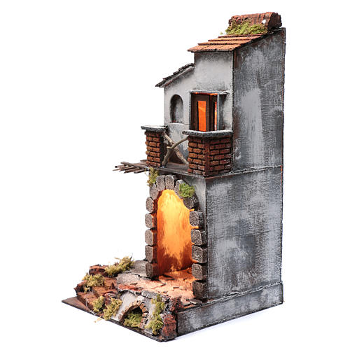 Nativity scene setting arched house with light and fireplace 45x25x25 cm 2