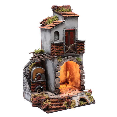Nativity scene setting arched house with light and fireplace 45x25x25 cm 3