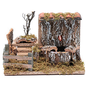 Nativity scene fountain with pump on rocky wall and roof