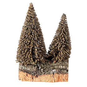 Nativity scene setting two pines on rock