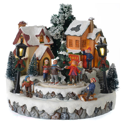 Christmas village with Ring a Ring-o' roses game and tree of 10 cm diameter 1