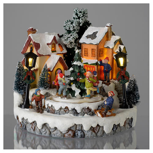 Christmas village with Ring a Ring-o' roses game and tree of 10 cm diameter 2