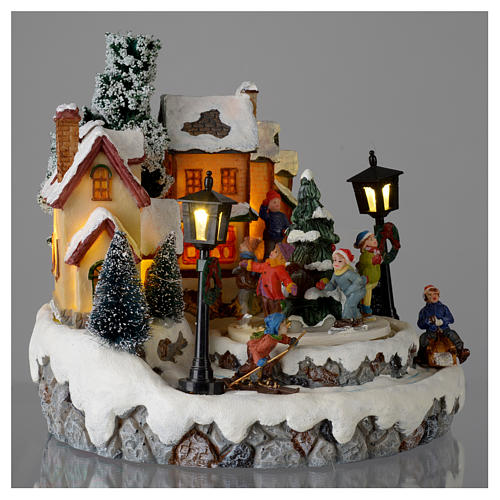Christmas village with Ring a Ring-o' roses game and tree of 10 cm diameter 4