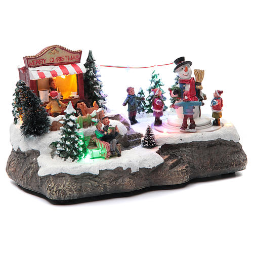 Christmas village with Ring a Ring-o' roses game and snowman  25x15x15 cm 3