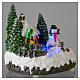 Village de Noël illuminé bonhomme de neige mouvement 20x20x15 cm s4