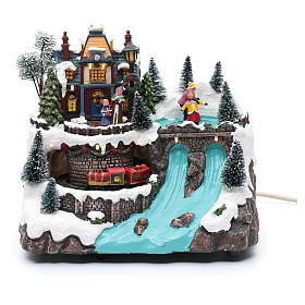 Pueblos navideños en miniatura: Paisaje navideño con música tren en movimiento y patinadores 25x25x15 cm