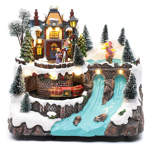 Musical christmas village with moving train and ice skating 25x25x15 cm 2