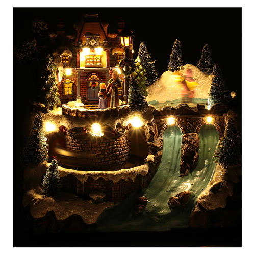 Musical christmas village with moving train and ice skating 25x25x15 cm 5