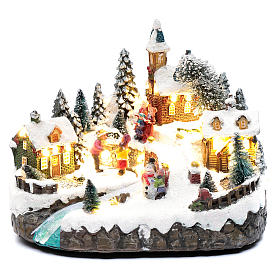 Animated village with ice skating and stream 20x25x20 cm