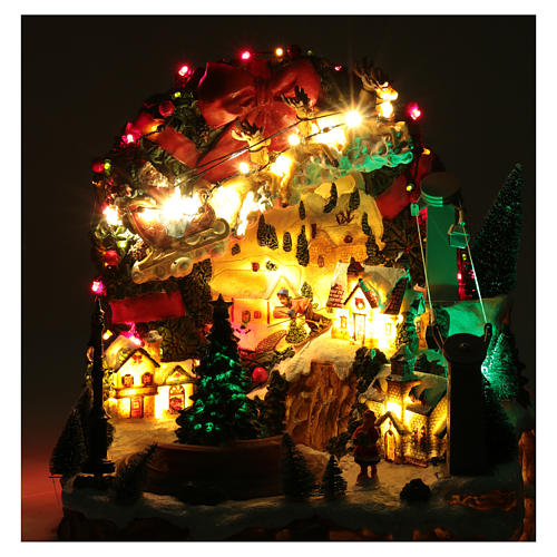 Escena de Navidad con luces y tren en movimiento 30x30x25 cm 4