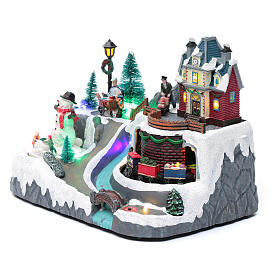 Pueblos navideños en miniatura: Paisaje de Navidad con musica tren y muñeco de nieve en movimiento 20x25x20 cm