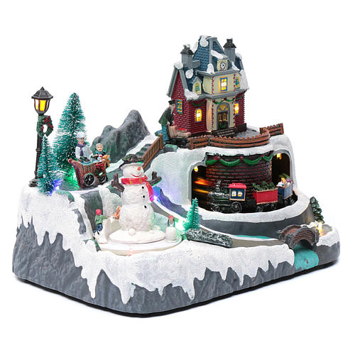 Paisaje de Navidad con musica tren y muñeco de nieve en movimiento 20x25x20 cm 3