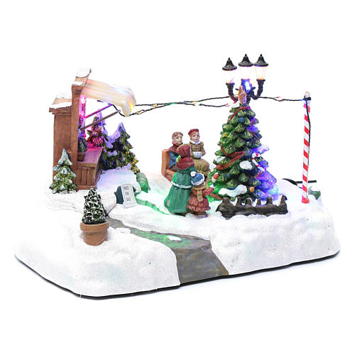 Paisaje de Navidad con negocio navideño música y árbol en movimiento 20x25x20 cm 3