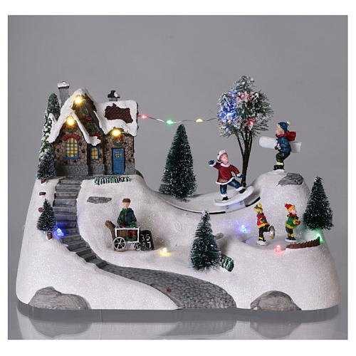 Moving christmas scene with music and ice skating rink 20x30x15 cm 2