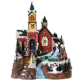 Illuminated Christmas village with animated skaters and music 38x28x30 cm