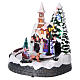 Christmas village illuminated with music and moving carriages 20X19X18 cm s3