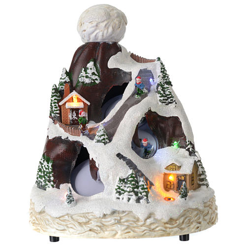 Christmas village hat shaped, with lights, music, movement and skiers 24X19X19 cm 1