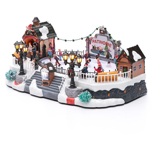Villaggio natalizio animato luminoso musicale movimento pattinatori 18X40X27 cm 2
