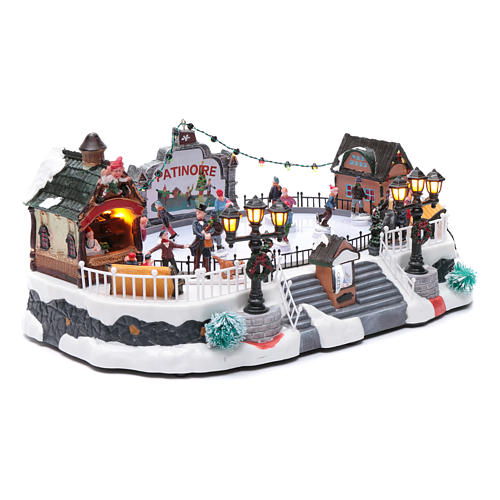 Villaggio natalizio animato luminoso musicale movimento pattinatori 18X40X27 cm 3